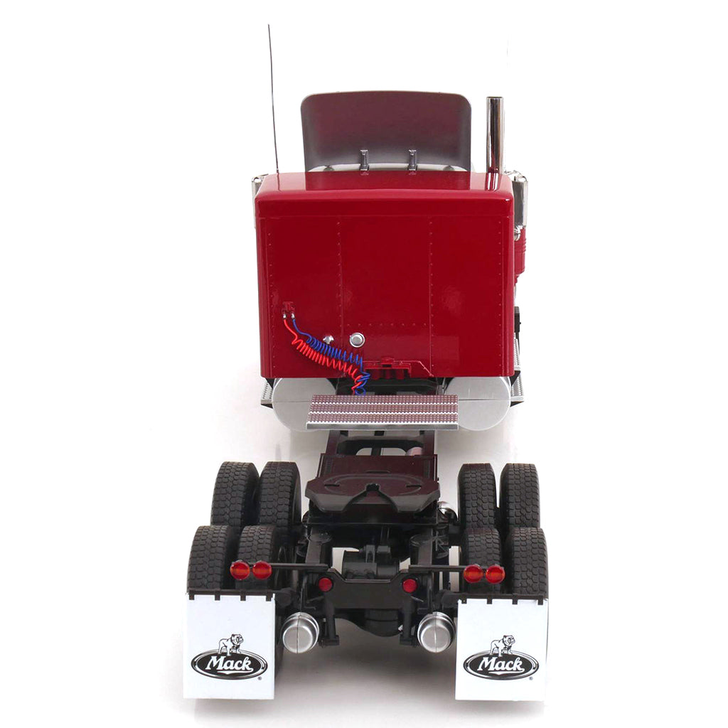 Model of a red and silver Mack R Model truck on a white background