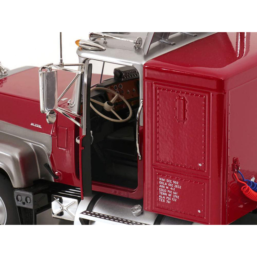 Close-up of a red Mack R Model truck model with open door