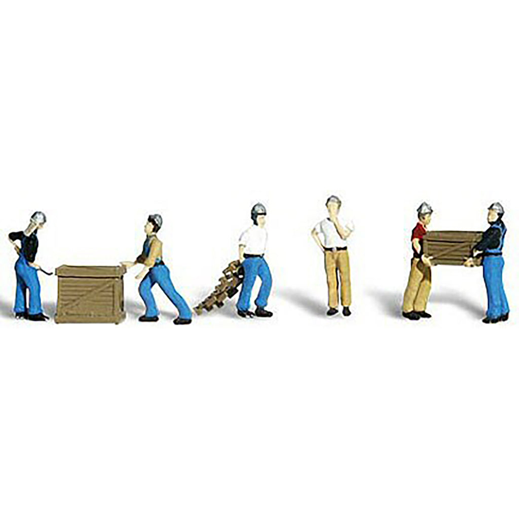 A set of miniature figurines depicting workers in various poses with wooden crates and a small cart, shown on a plain white background.