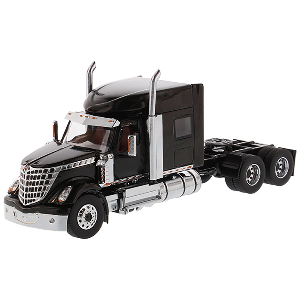 Model of a Black International LoneStar Mid-Roof Sleeper Tractor on a White Background