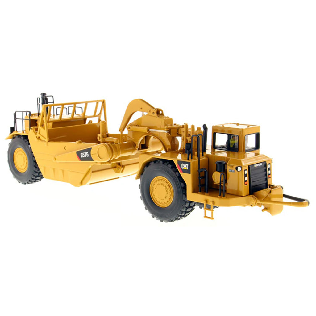 A yellow Caterpillar 657G Wheel Tractor Scraper toy vehicle with black and gray details, part of the High Line Series.