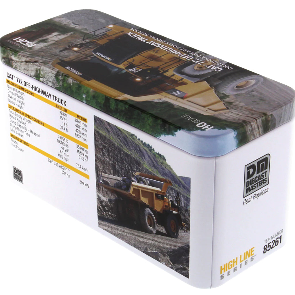 Model of a Caterpillar 772 Off-Highway Dump Truck in Tin Box Packaging on a White Background