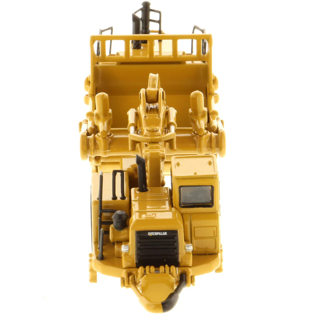 Model of a Caterpillar 657G Wheel Tractor Scraper on a White Background