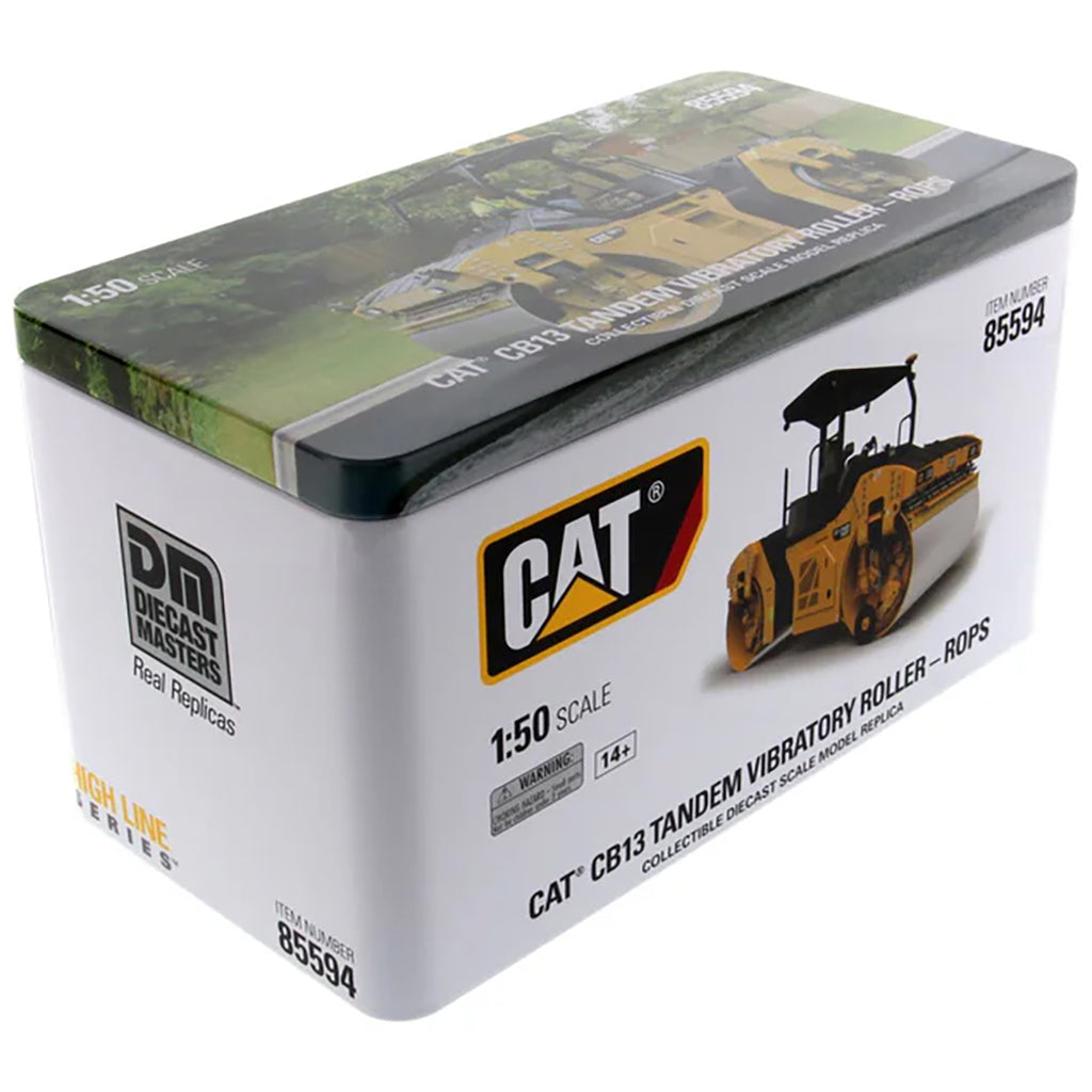 Boxed model of a Caterpillar CB13 tandem vibratory roller with DM Diecast Masters branding.