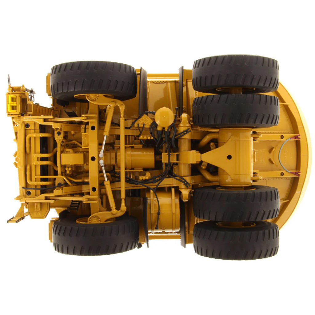 Model of a Large Caterpillar 798 AC Off Highway Electric Drive Mining Dump Truck on a White Background