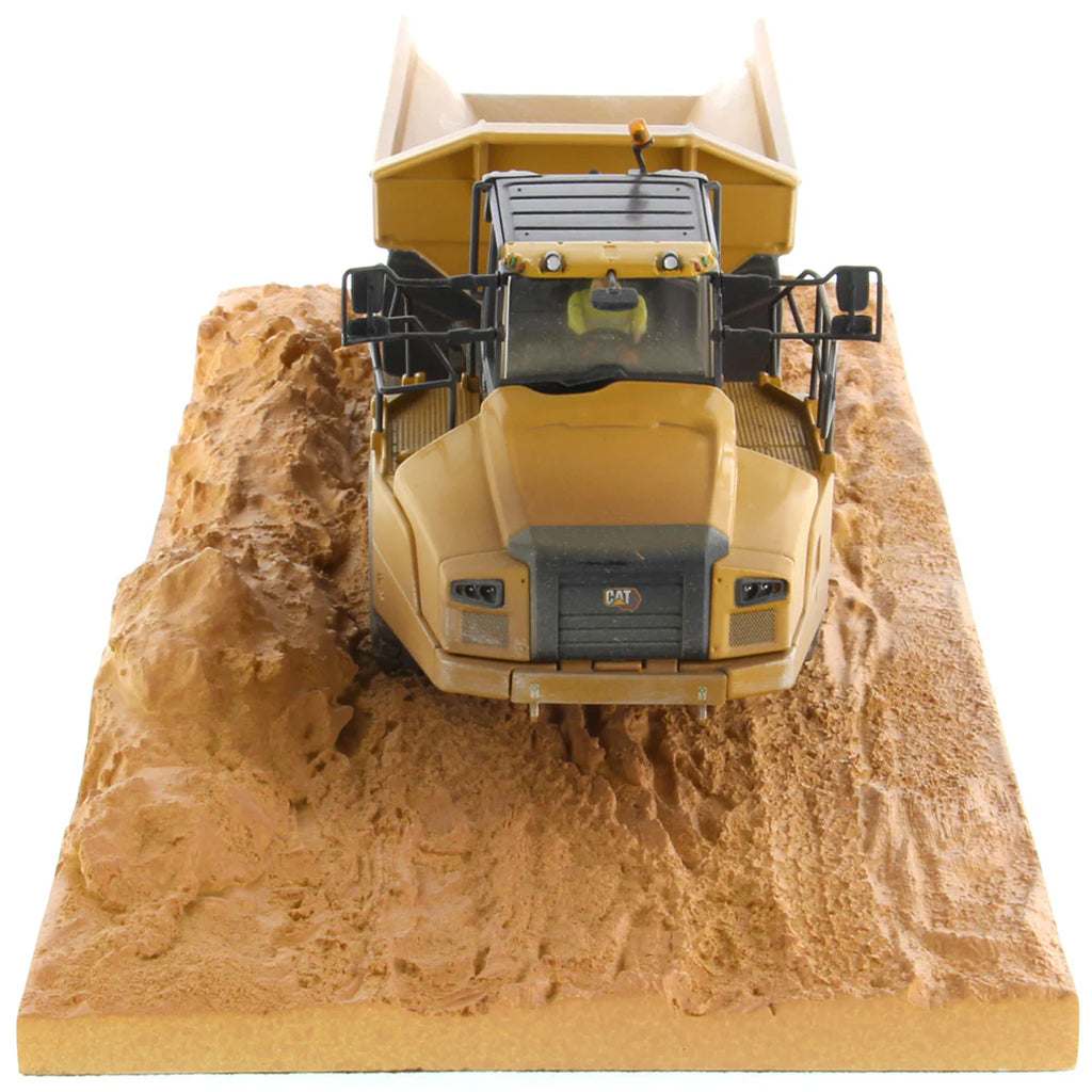 Model of Weathered Caterpillar 745 Articulated Dump Truck Mounted on a Simulated Dirt Road Base on a White Background