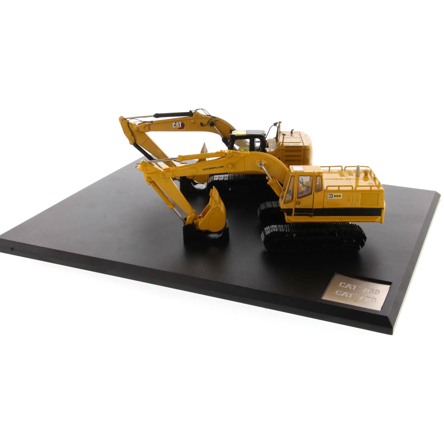 Model of a yellow Caterpillar excavator on a black platform with a white background