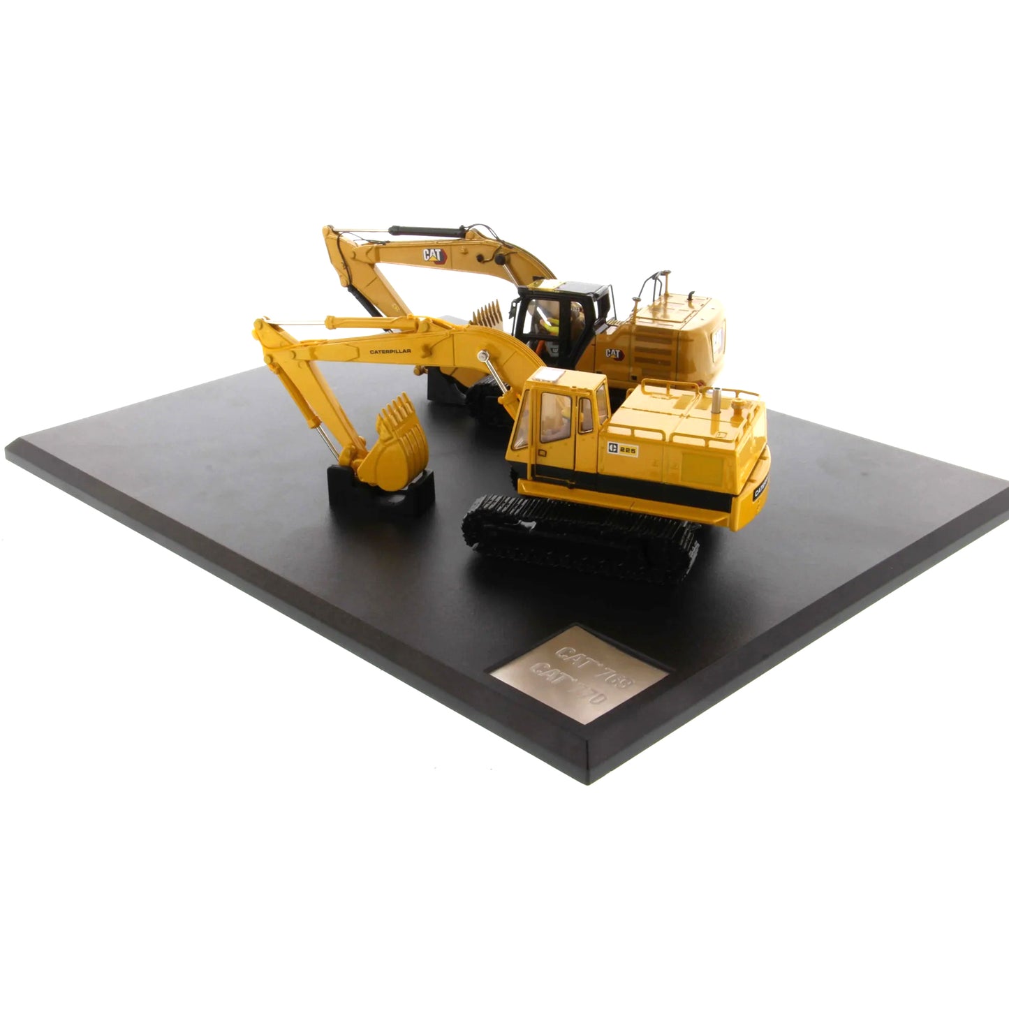 Model of a yellow excavator on a black platform with a white background