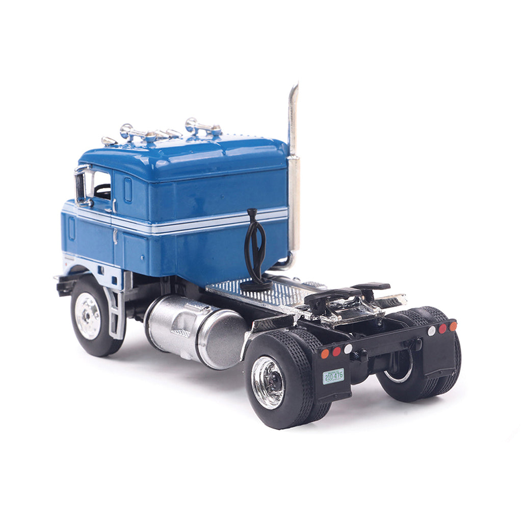 Model of a blue 1950 Kenworth 521 Bullnose truck on a white background