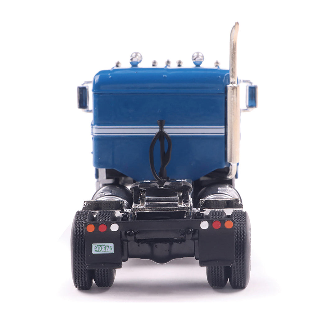 Model of a blue 1950 Kenworth 521 Bullnose truck on a white background