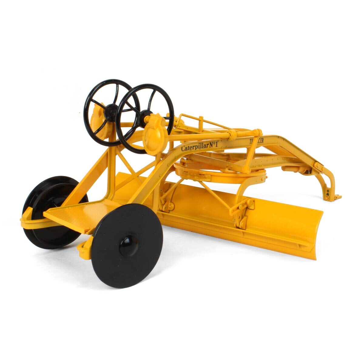Model of a yellow Caterpillar tractor on a white background