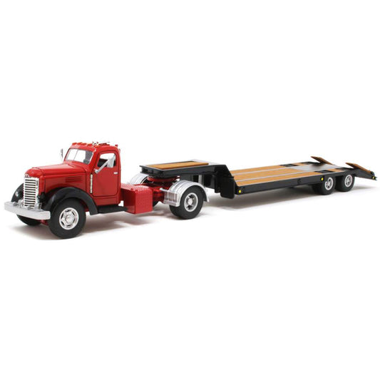 Model of an old-fashioned international kb-8 red tractor with a black lacrosse lowboy trailer on a white background