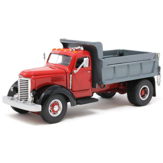 Model of an old-fashioned international kb-8 red dump truck with a gray bed on a white background