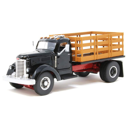 Model of an old-fashioned international kb-8 black stakebed truck with a black bed on a white background