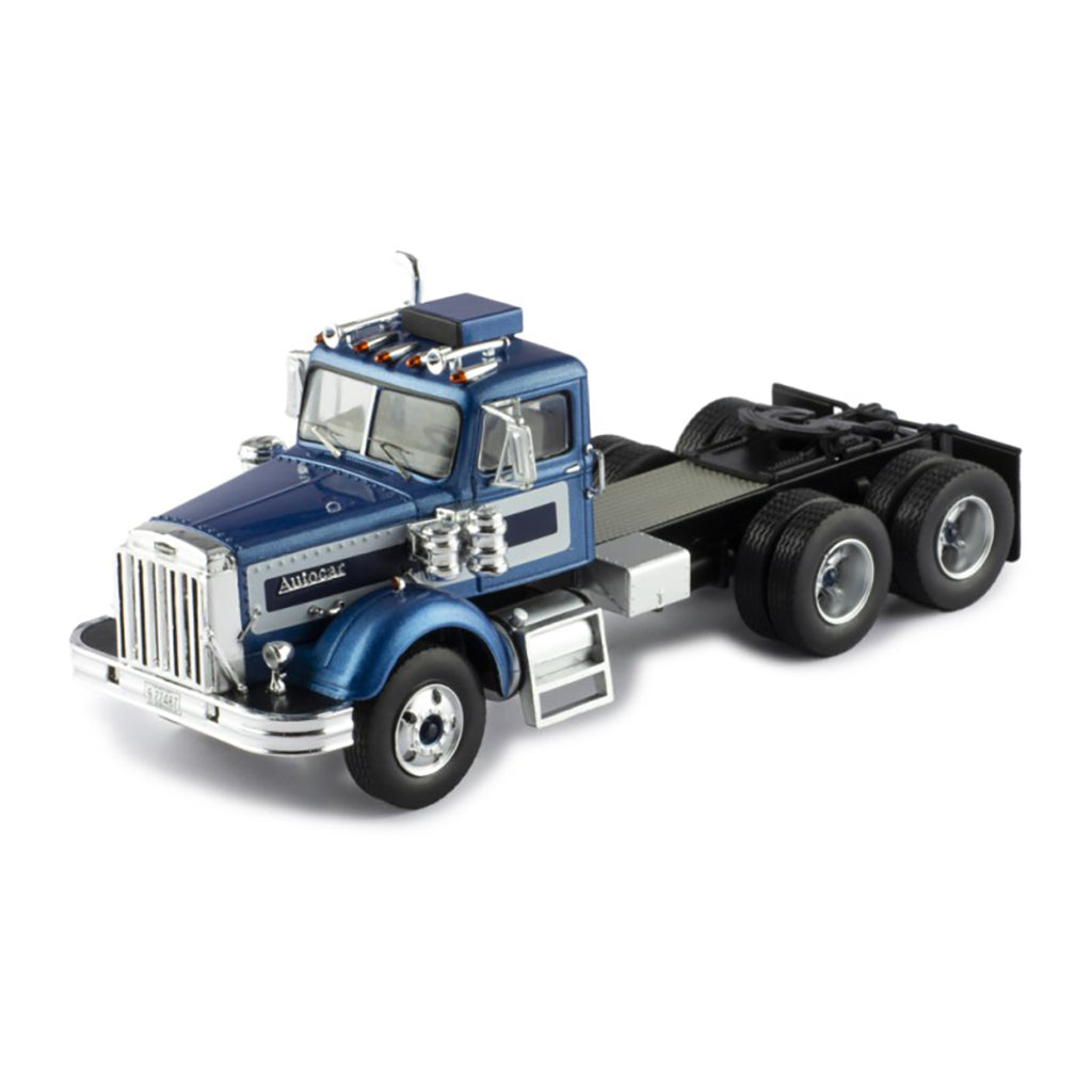 Model of a blue and silver Autocar truck on a white background