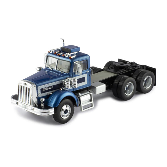 Model of a blue and silver Autocar truck on a white background