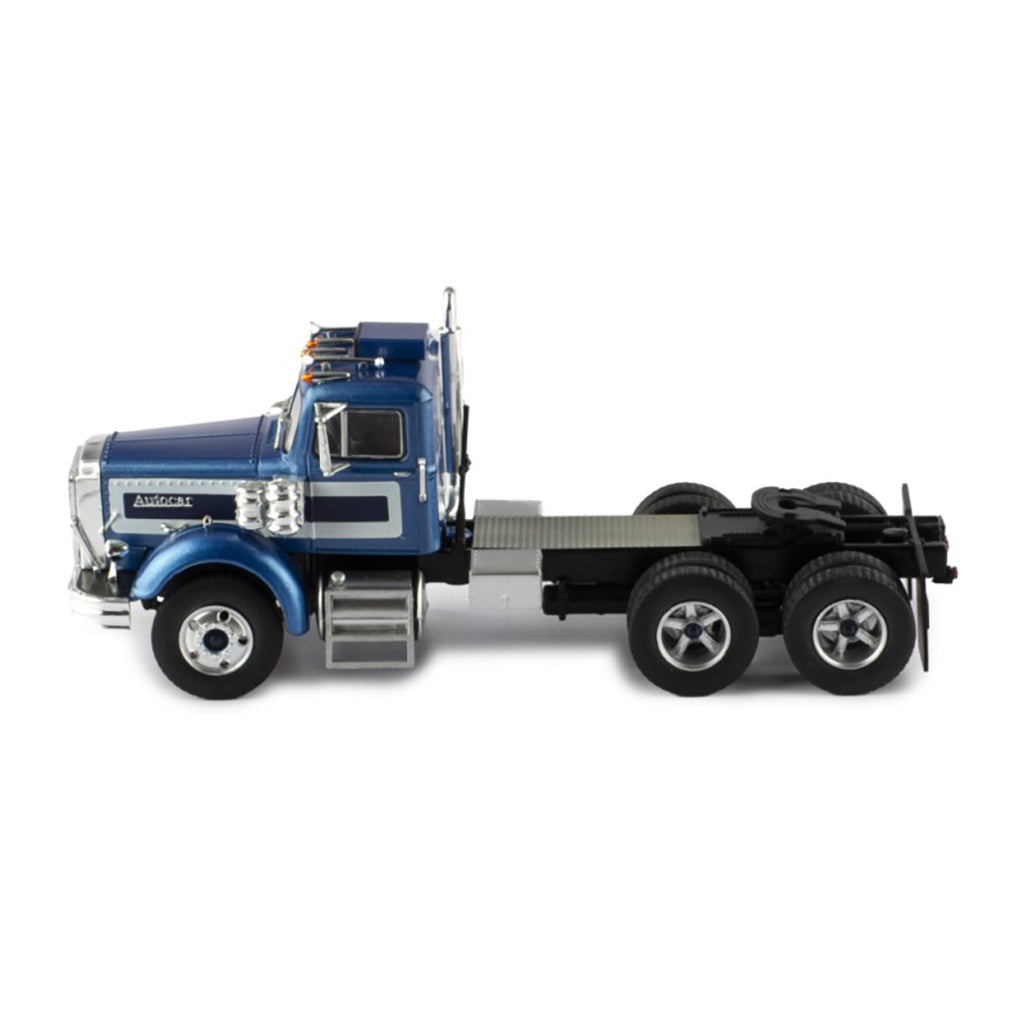 Model of a blue and silver Autocar truck on a white background