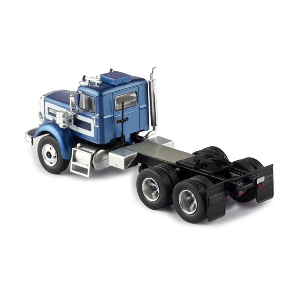 Model of a blue and silver Autocar truck on a white background