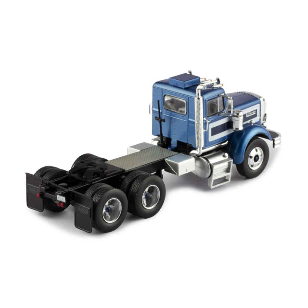 Model of a blue and silver Autocar truck on a white background