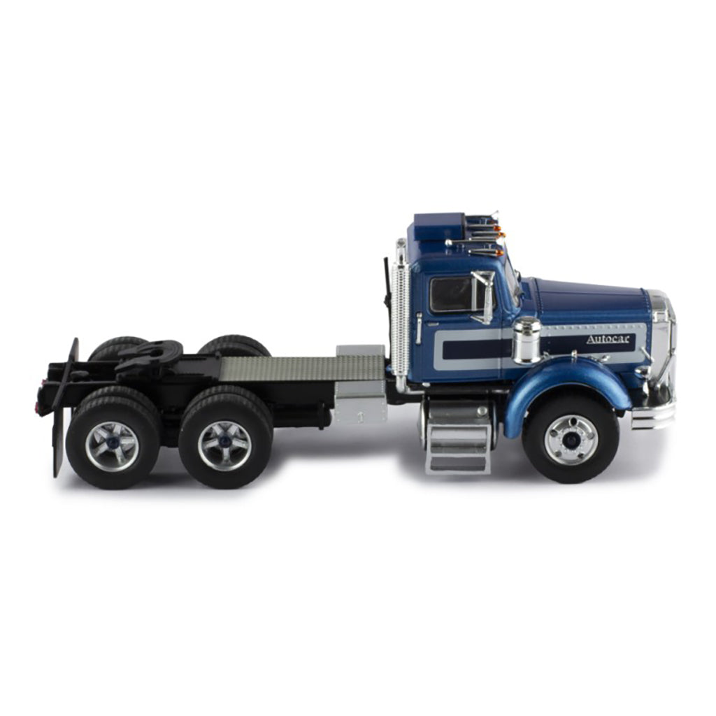 Model of a blue and silver Autocar truck on a white background