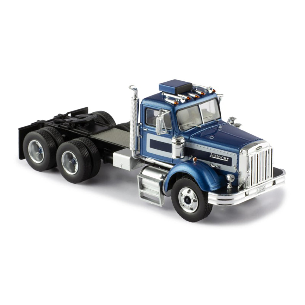 Model of a blue and silver Autocar truck on a white background