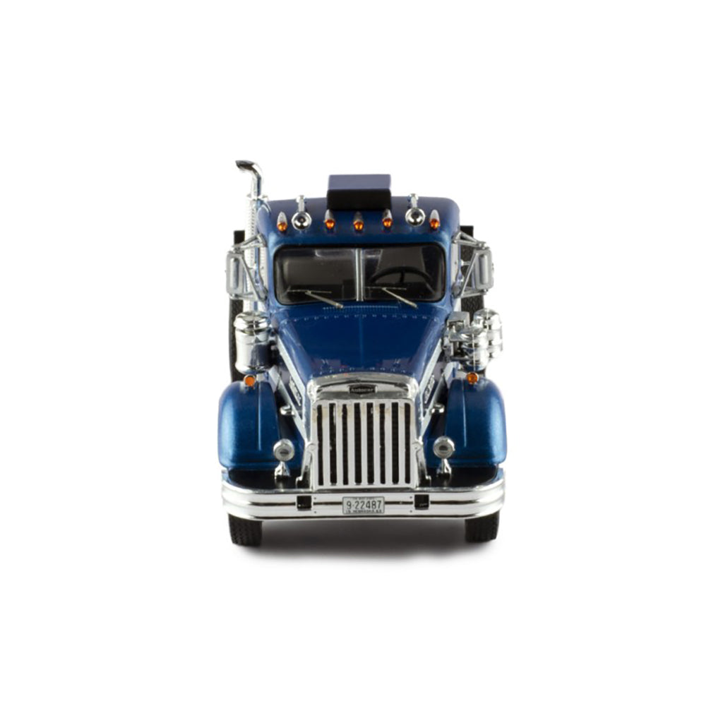 Model of a blue and silver Autocar truck on a white background