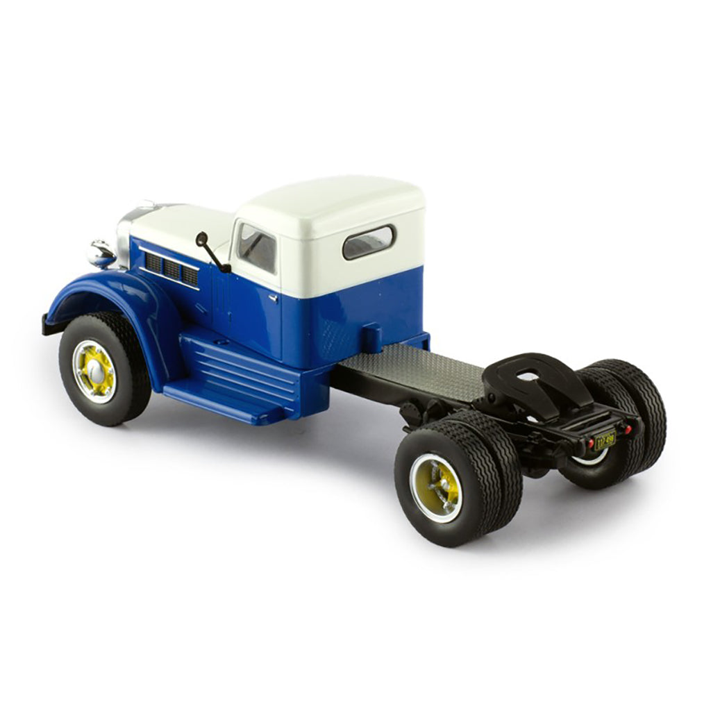 Model of a blue and white Federal truck on a white background