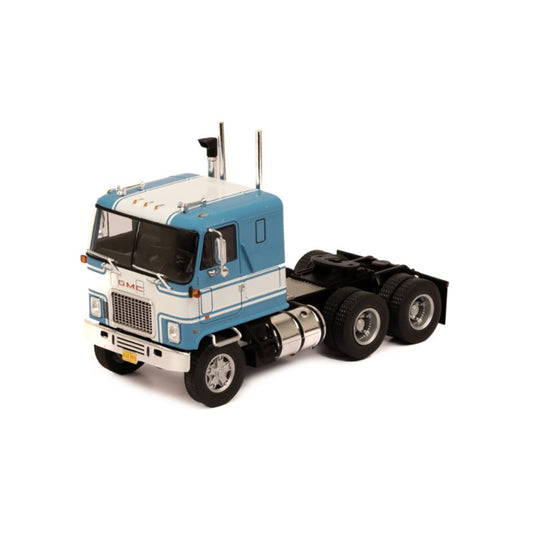 Model of a blue and white GMC Astro Cab Over truck on a white background