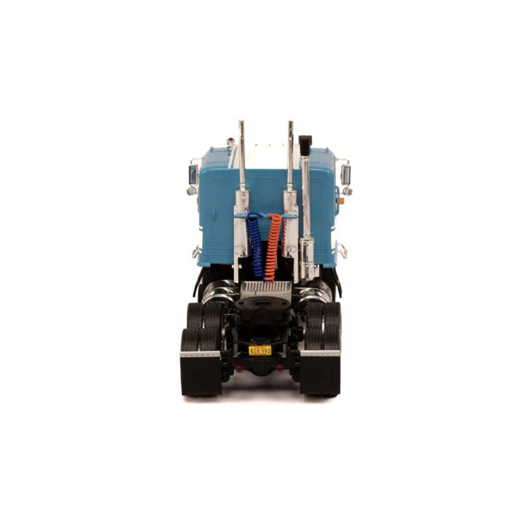 Model of a blue and white GMC Astro Cab Over truck on a white background