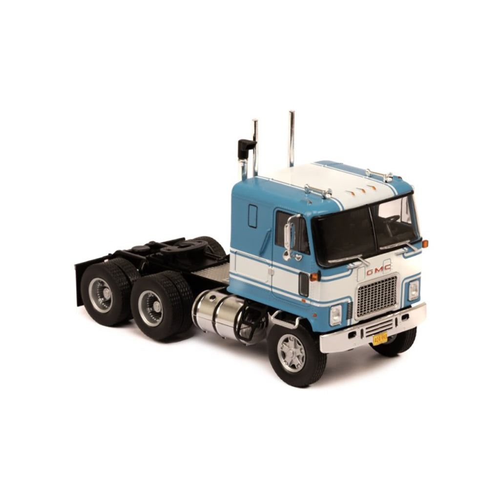 Model of a blue and white GMC Astro Cab Over truck on a white background