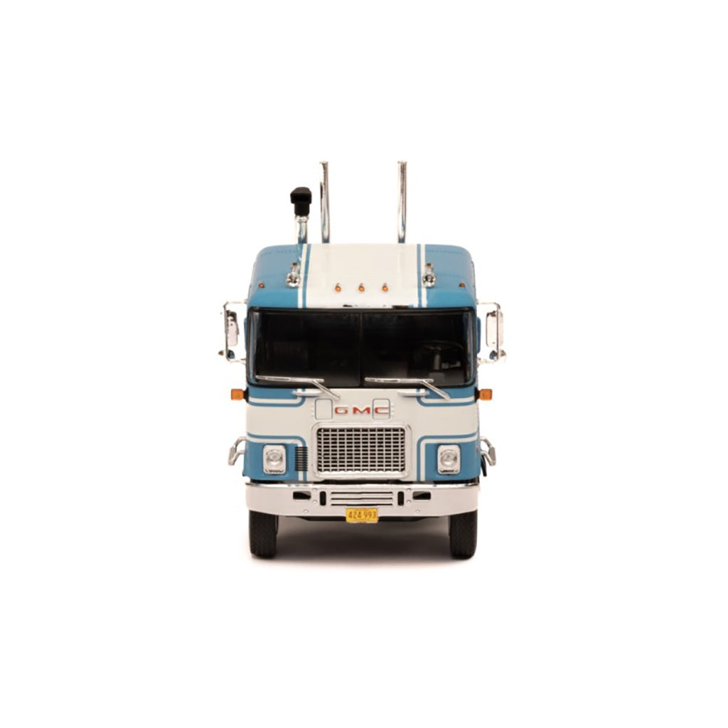 Model of a blue and white GMC Astro Cab Over truck on a white background