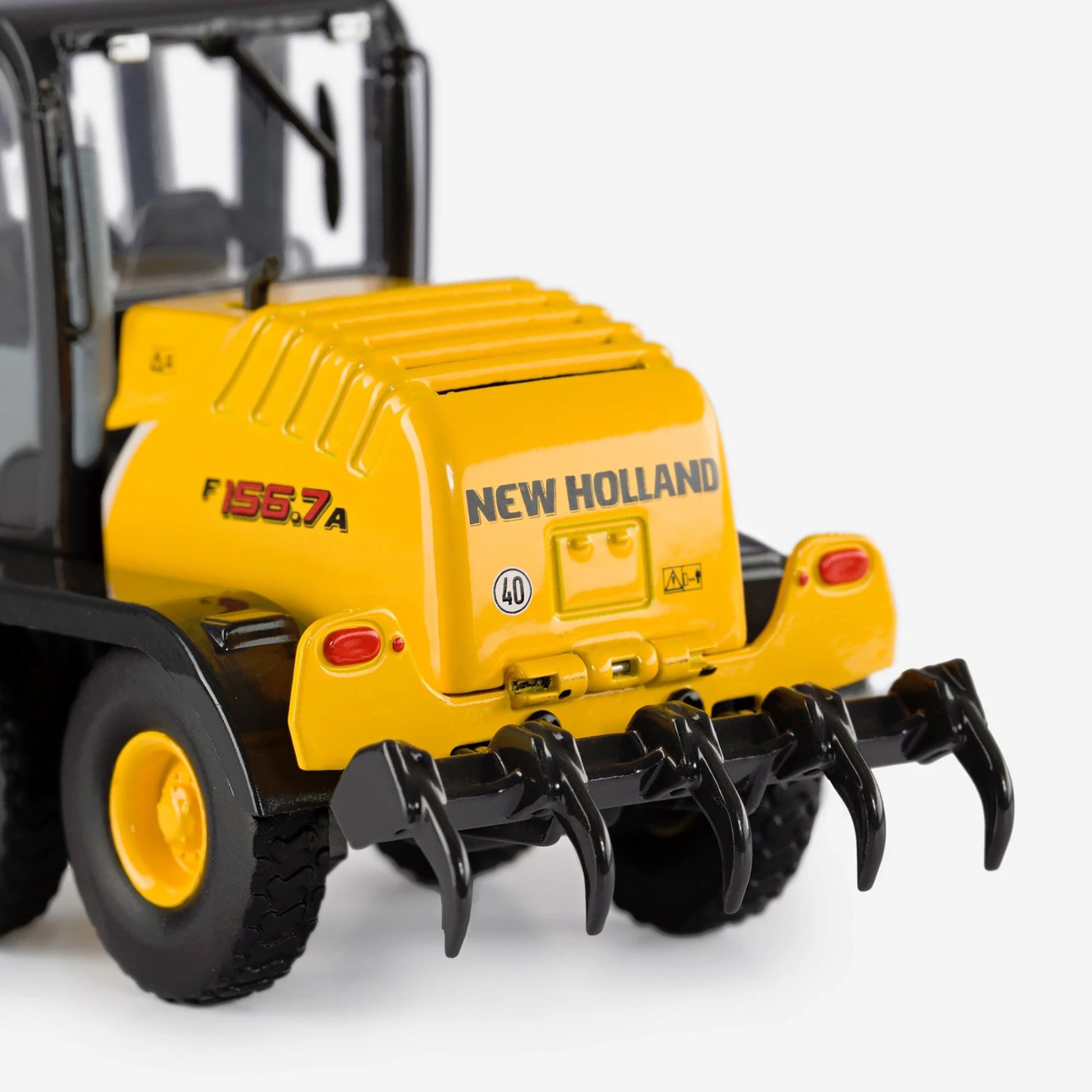 Model of a New Holland tractor on a white background