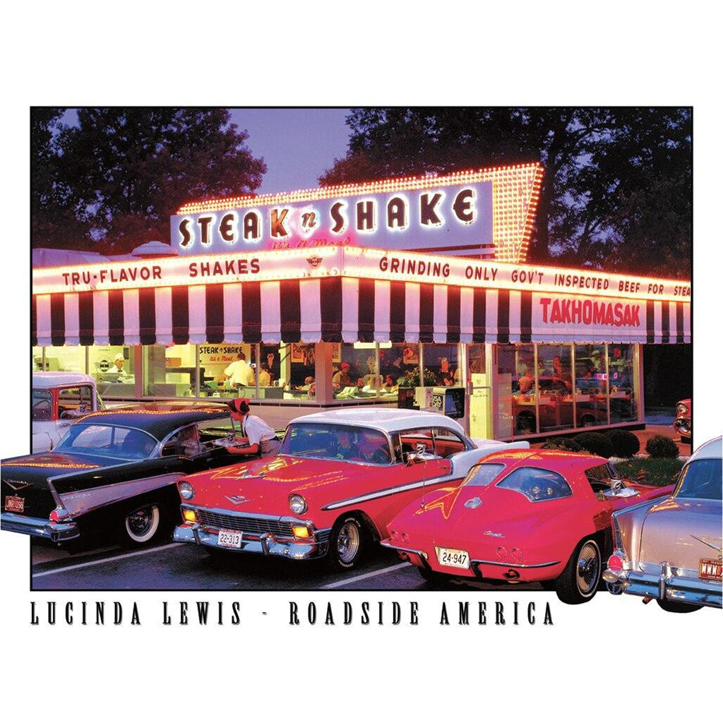 Vintage Steak 'n Shake restaurant with classic cars in front, featuring Lucinda Lewis' 'Roadside America' collection.