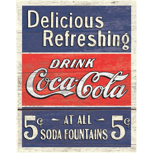 Vintage Coca-Cola sign with red, white, and blue colors on a wooden background.