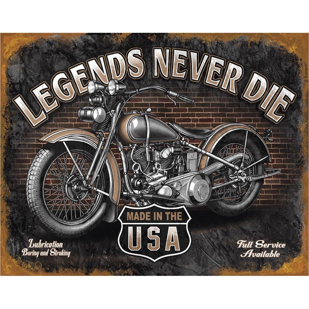 Motorcycle with 'Legends Never Die' text on a brick wall background