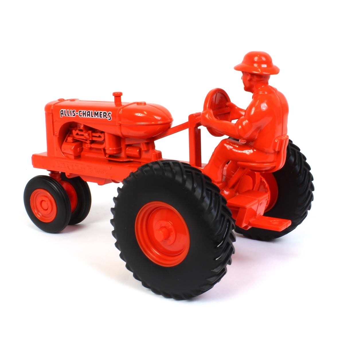 Orange toy tractor with driver figure on a white background