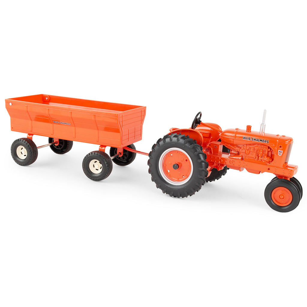 Orange Allis-Chalmers toy tractor with a flarebox wagon on a white background