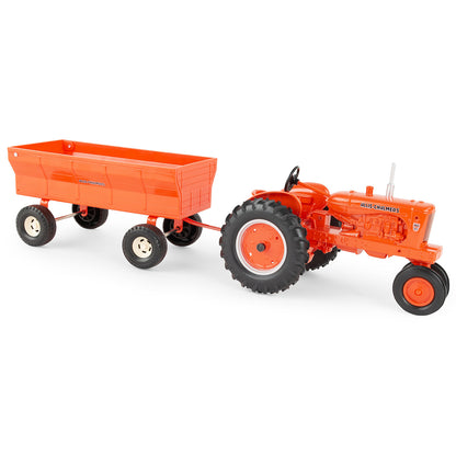 Orange Allis-Chalmers toy tractor with a flarebox wagon on a white background
