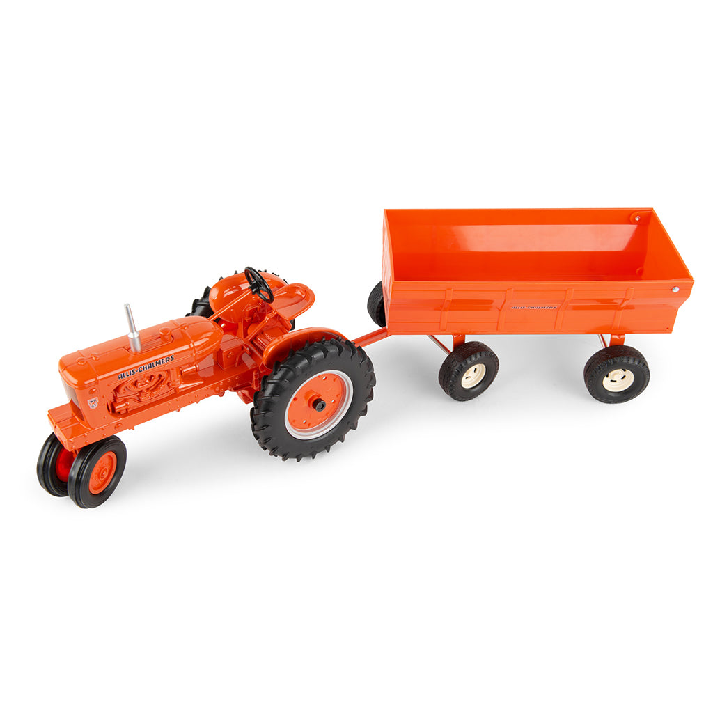 Orange Allis-Chalmers toy tractor with a flarebox wagon on a white background
