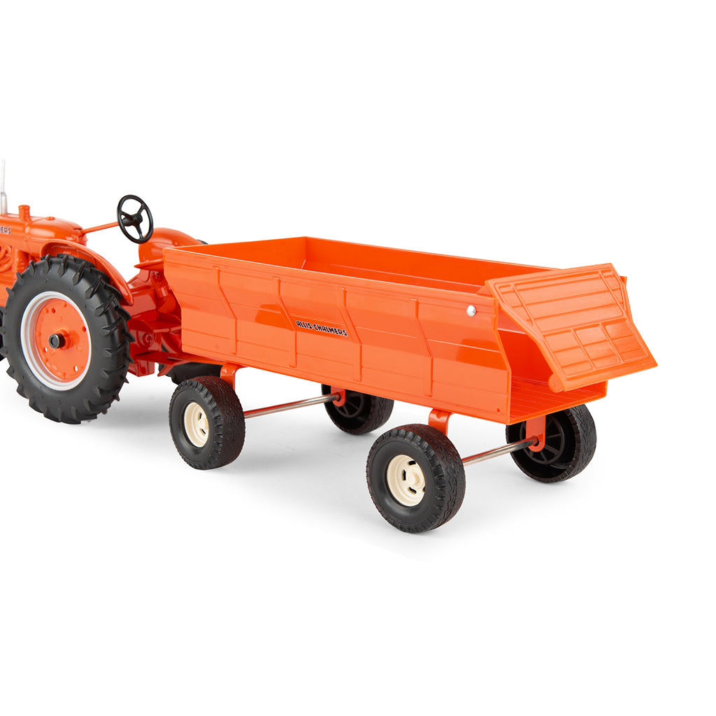 Orange Allis-Chalmers toy tractor with a flarebox wagon on a white background