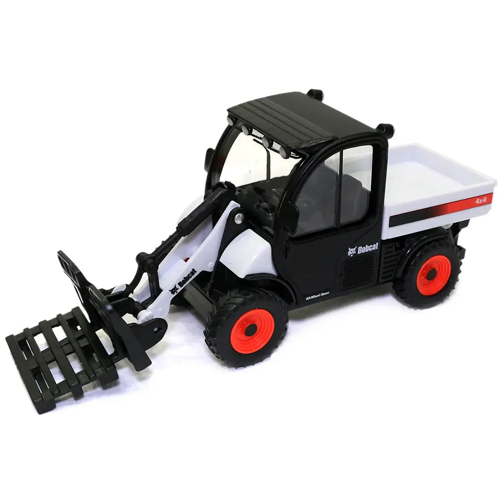 A toy model of a Bobcat compact skid steer loader with a front bucket attachment, featuring a black and white body with red wheels and a white cargo bed.