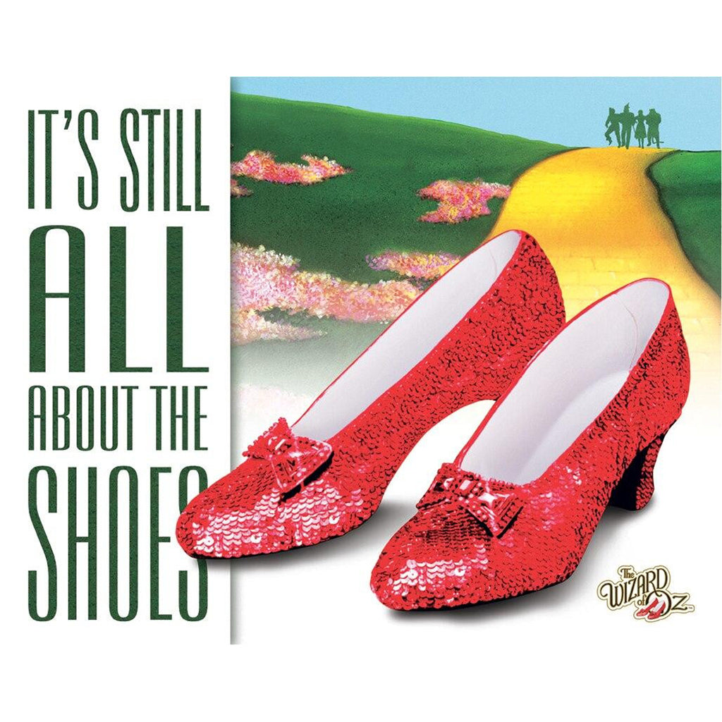 Red sequined shoes with text 'It's Still All About the Shoes' and 'The Wizard of Oz' logo.
