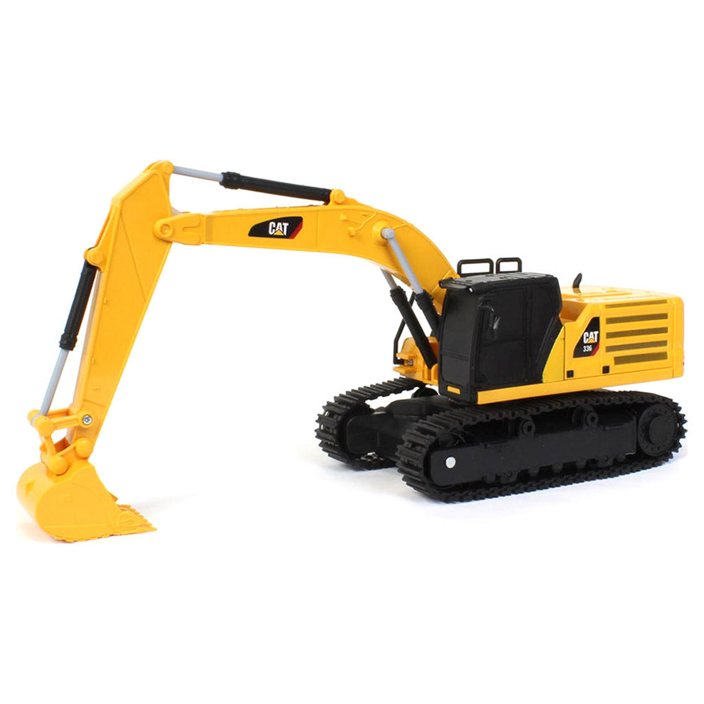 A yellow and black CAT toy remote control excavator with a bucket attachment, photographed on a clean white background.
