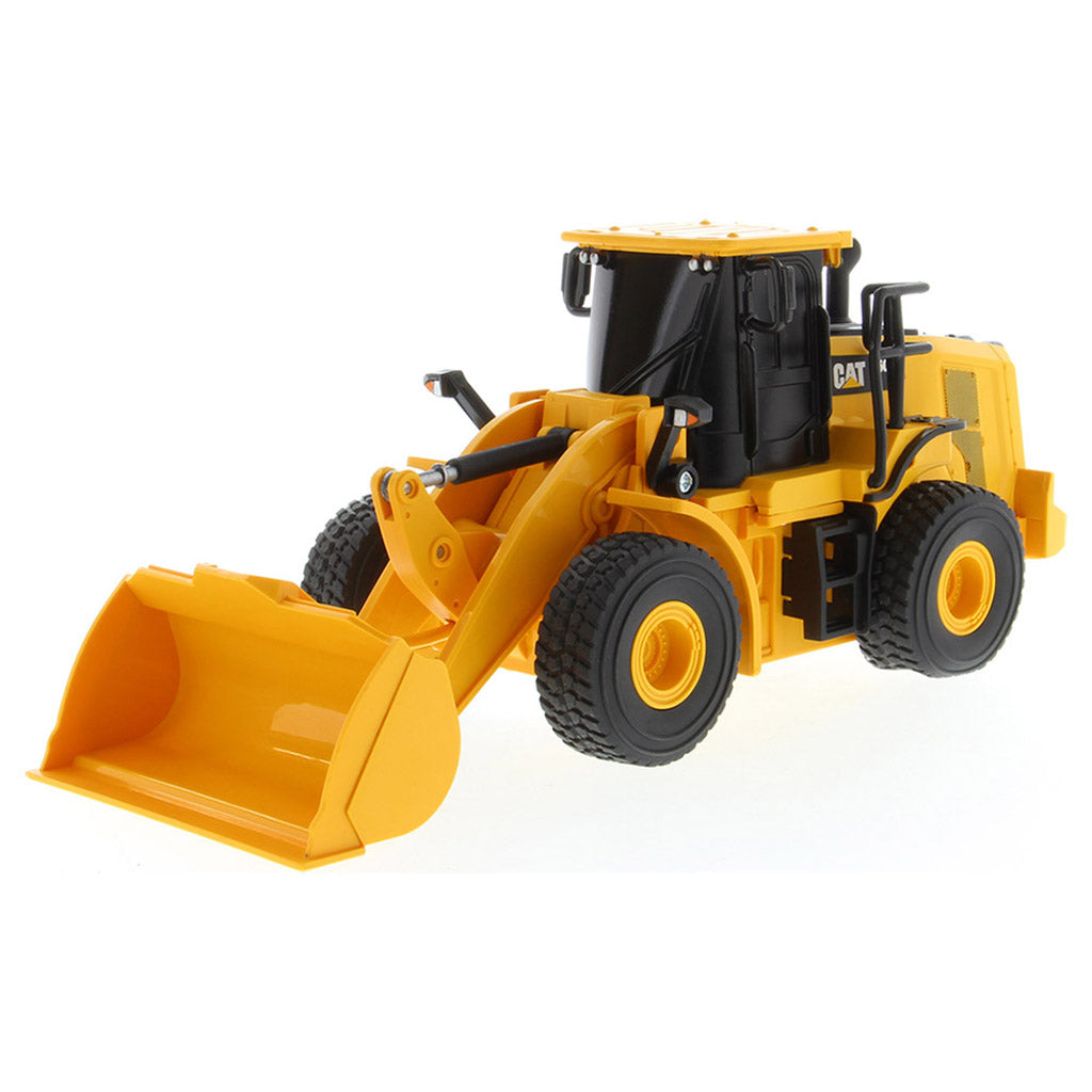 A yellow and black radio controlled wheel loader with a front bucket loader, photographed on a clean white background. The brand name CAT is visible on the side of the cab.