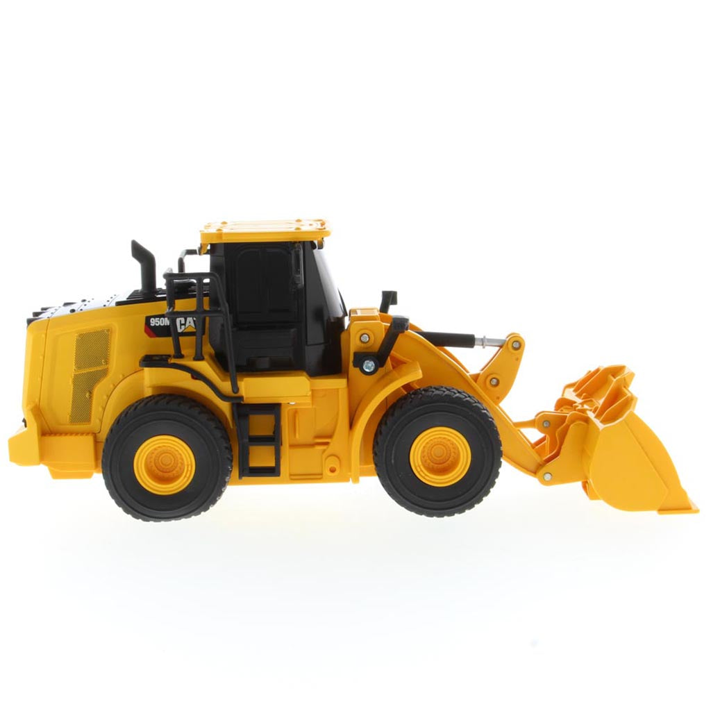 A yellow and black radio controlled wheel loader with a front bucket loader, photographed on a clean white background. The brand name CAT is visible on the side of the cab.