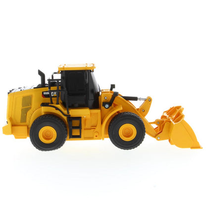 A yellow and black radio controlled wheel loader with a front bucket loader, photographed on a clean white background. The brand name CAT is visible on the side of the cab.