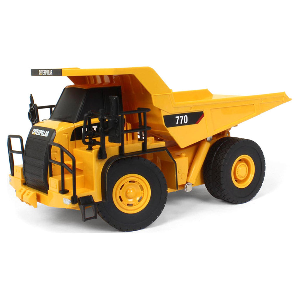 Toy Remote Controlled Yellow and Black Caterpillar 770 Dump Truck on a White Background