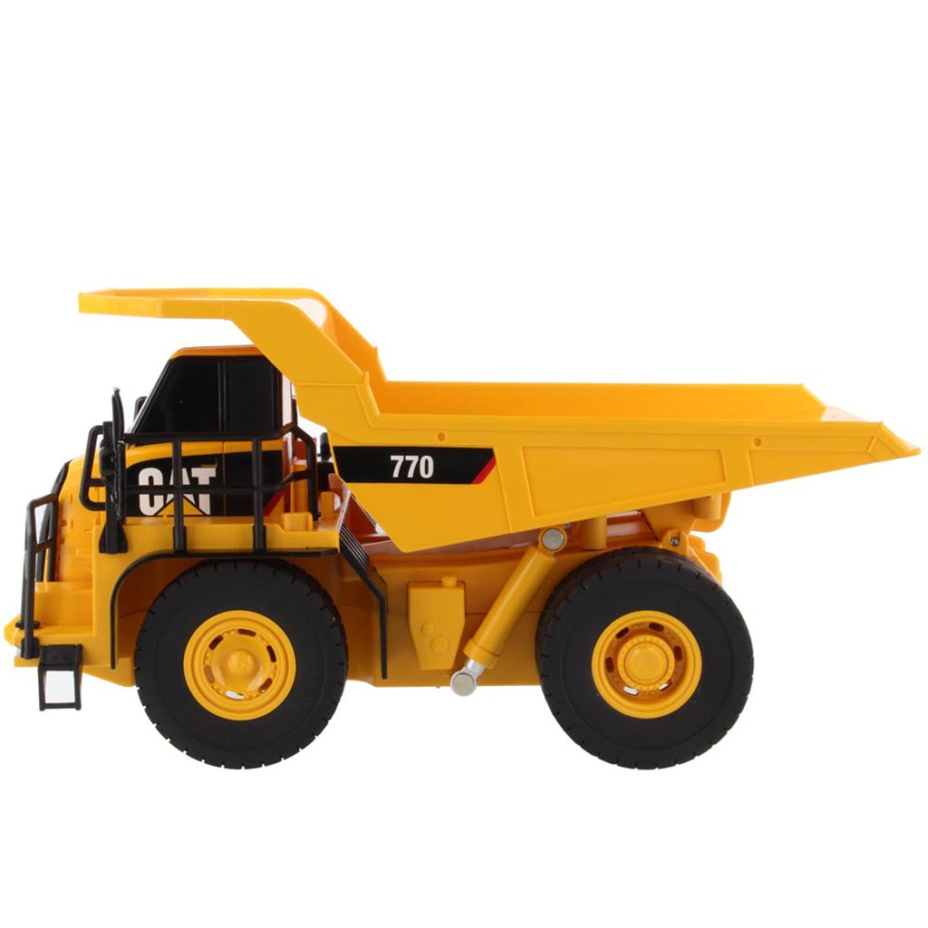 Toy Remote Controlled Yellow and Black Caterpillar 770 Dump Truck on a White Background