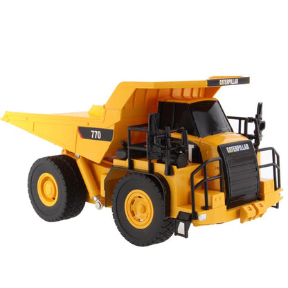 Toy Remote Controlled Yellow and Black Caterpillar 770 Dump Truck on a White Background