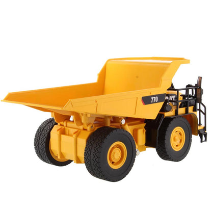 Toy Remote Controlled Yellow and Black Caterpillar 770 Dump Truck on a White Background